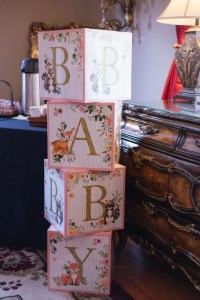 Stacked decorative baby blocks spell 
